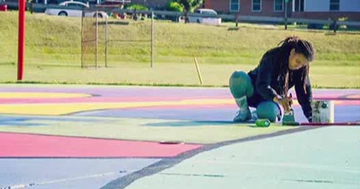 Charlotte artist using her talent to inspire others paint basketball